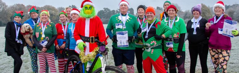 The Grinch and runners dressed as elves on a frosty morning after the first ever Solent Mind Mental Elf run