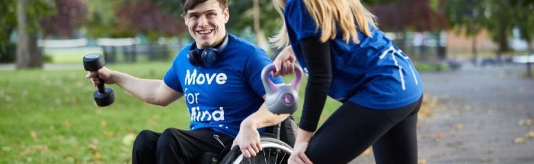 A man in a wheelchair and a girl both do exercises in Move for Mind tshirts