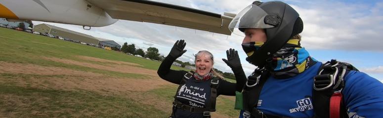 Excited skydivers after jumping